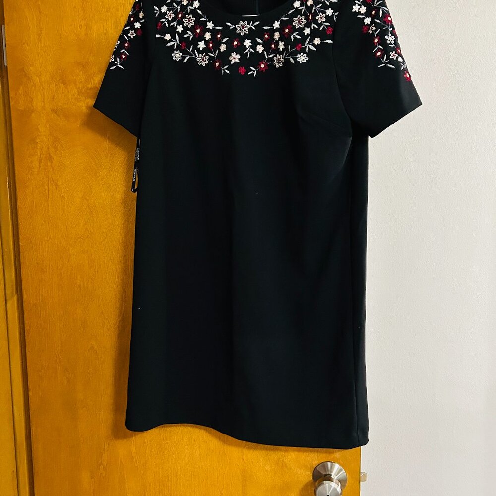 Calvin Klein black dress with flowers around neck